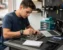 Phone repair training scene illustrating tools you need for a phone repair course (beginner kit checklist) with real devices, tools, and hands-on learning context
